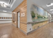 Thumbnail 29 of 54 - A room with a mural of a sailboat on the wall.