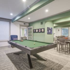 our apartments have a lounge with a pool table and dining area