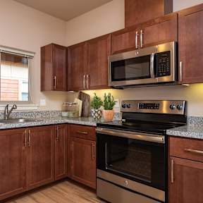 two washers and dryers in a laundry room