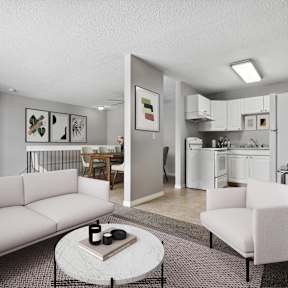 A living room with a couch, chair, and coffee table.