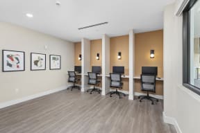 accommodation type with a desk and chairs and a window