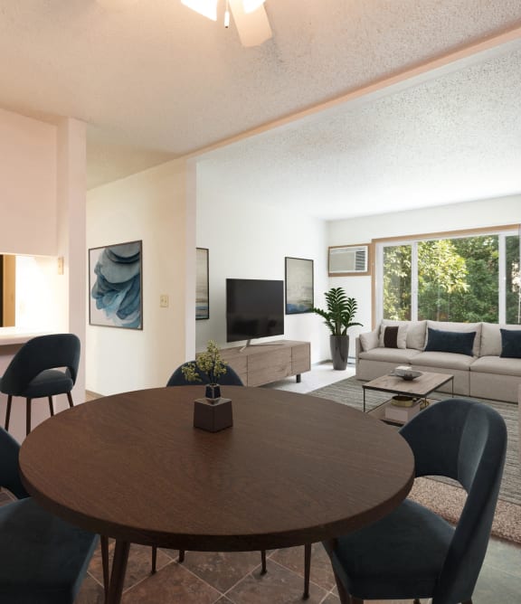a living room and dining room with a table and chairs