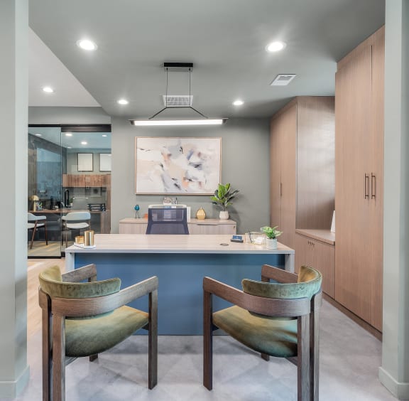 a dining room with a blue counter and chairs