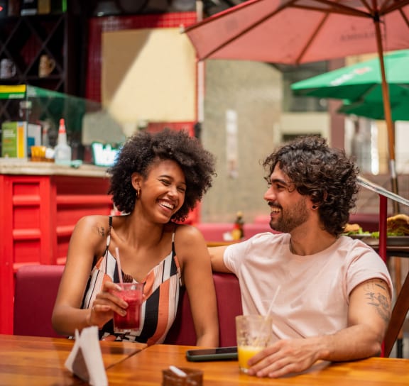 a man and a woman sitting at a table at a restaurant