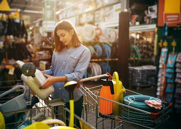 A family of three are shopping in a supermarket.