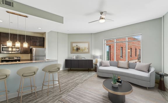 an open living room and kitchen with a couch and a table
