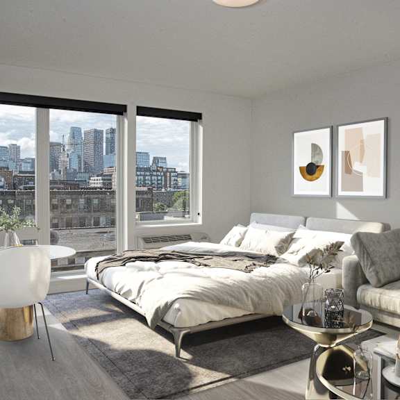 A modern bedroom with a large bed and a view of the city.