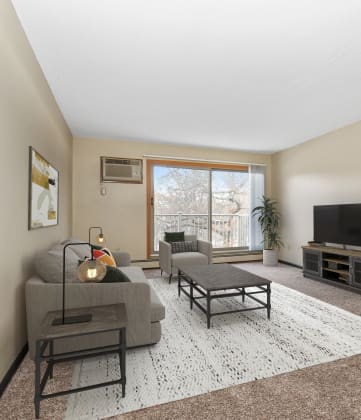 a living room with beige walls and carpet