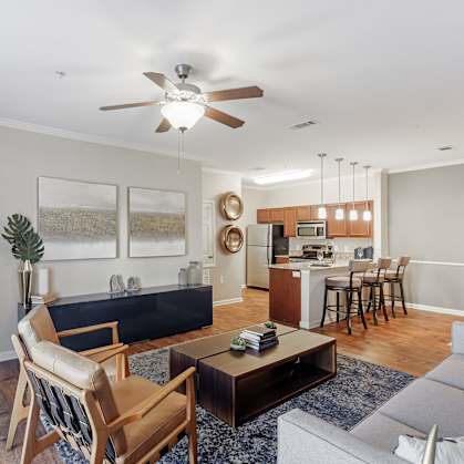 a living room with a couch and a table at Cumberland Place Apartment Homes, Tyler