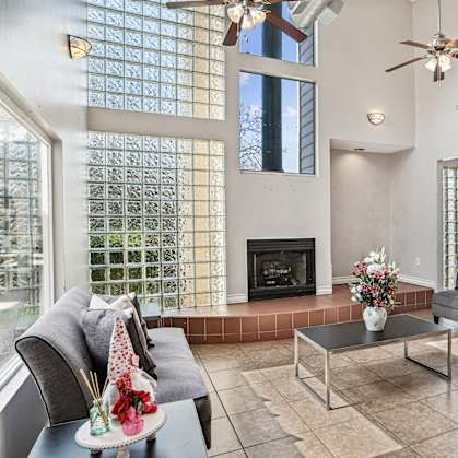 a living room with couches and a fireplace