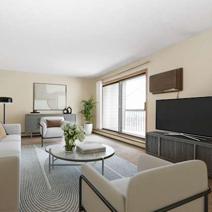 a living room with a couch and a table and a television. Anoka, MN Dellwood Estates