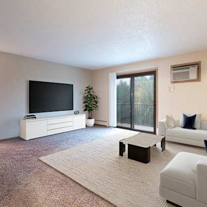 a living room with a couch and a tv