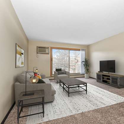 Coon Rapids, MN Parkview Estates |a living room with beige walls and carpet