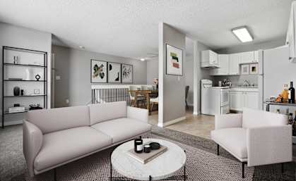 A living room with a couch, chair, and coffee table.