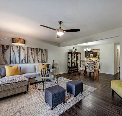 A living room with a grey sofa and a yellow chair.