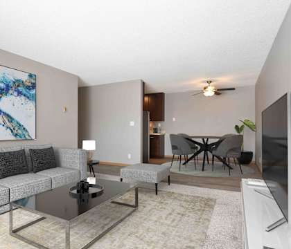 a living room with a couch and a glass table