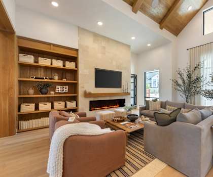 a living room with a fireplace and couches