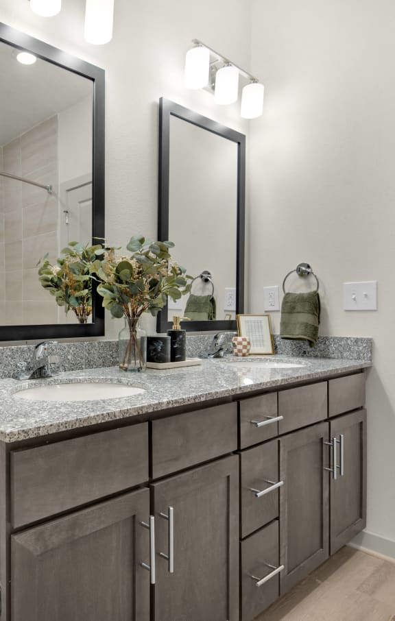 a bathroom with a sink and a mirror at The Enclave at Deer Moss Creek, Niceville, FL