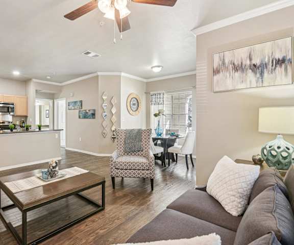 a living room with a couch and a table  at TalaVera Apartments, Texas, 78232