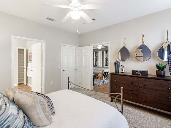 a living room with a couch and a ceiling fan  at Cumberland Place Apartment Homes, Texas, 75703