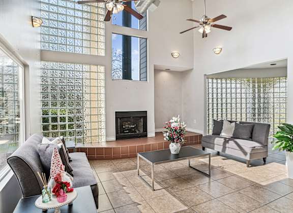a living room with couches and a fireplace