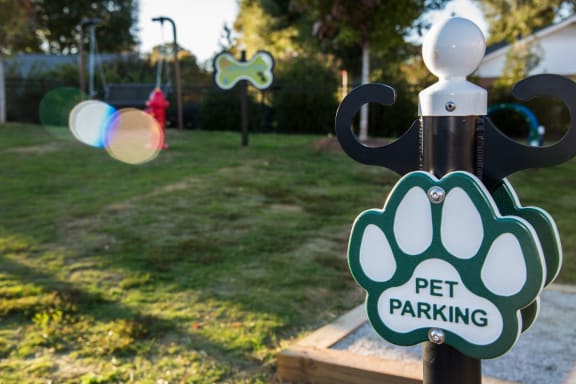 a pet parking sign on a pole in a park at Echo at Lake Norman, Mooresville, NC