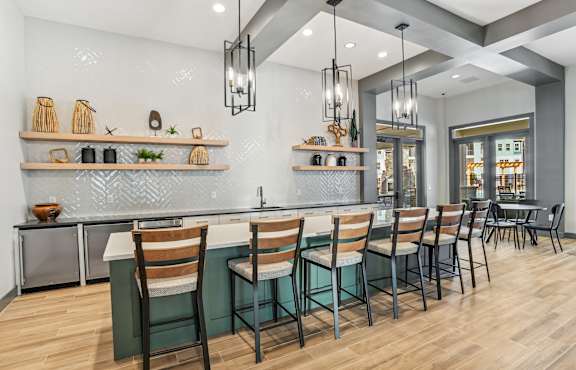 Clubhouse lobby kitchen area with barstools in our apartments in Indian Land, SC.