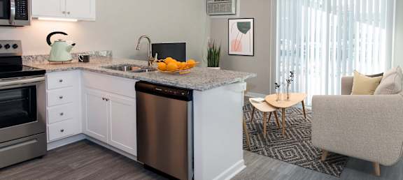 A modern kitchen with a dining area.