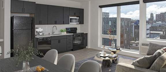 A modern kitchen with a dining table and chairs.
