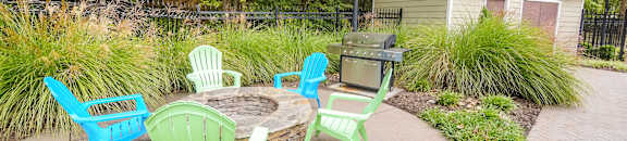 A patio with a table and chairs at Highlands Apartment Homes, Bartlett, Tennessee
