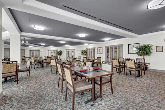 A large room with tables and chairs.