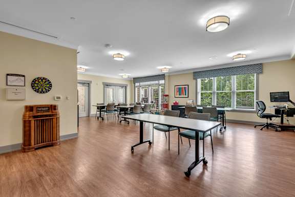 A conference room with a long table and chairs.