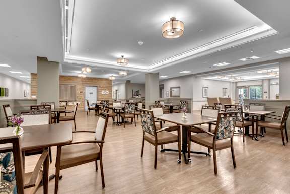 A large room with tables and chairs.