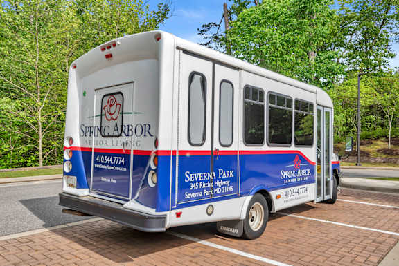 A Spengareor Living bus parked in a parking lot.