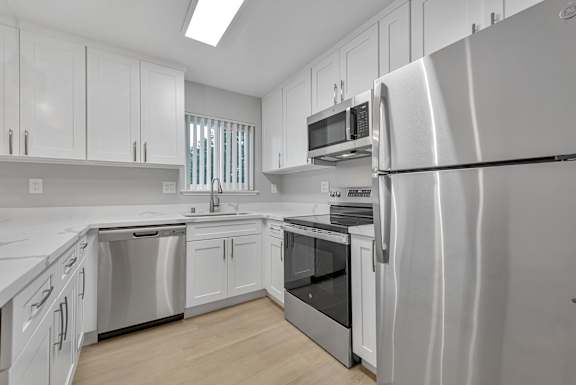 a small kitchen with a stove and a sink