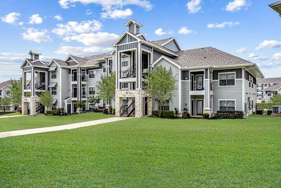 Apartment building with a blue and beige exterior.