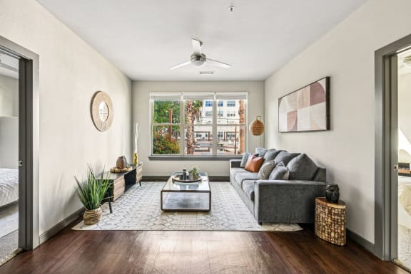 the living room of an apartment with a couch and a coffee table