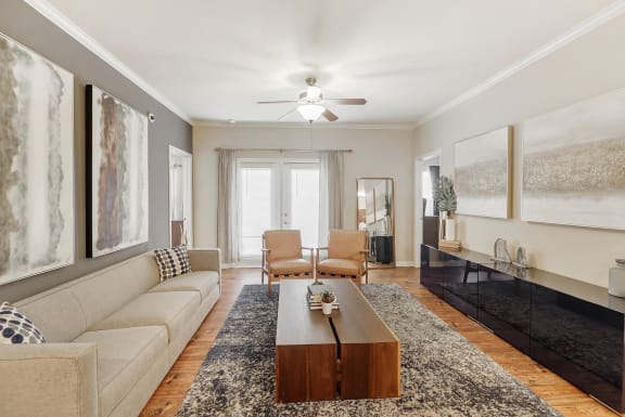a living room with a couch and a coffee table at Cumberland Place Apartment Homes, Tyler, TX 75703