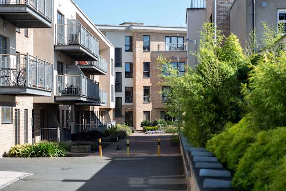 our apartments are located in a quiet neighborhood with trees and bushes