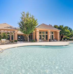 Resort Style Swimming Pool with Cabana and picnic area with tables and chairs and beach chairs