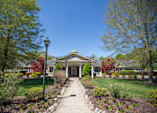 Thumbnail 1 of 31 - A house with a front yard and a lamp post.