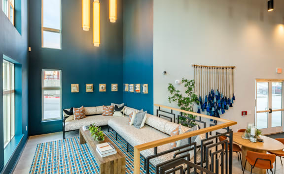 a living room with blue walls and a large couch