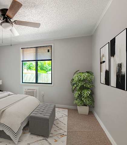 a furnished apartment bedroom at Mount Dora Apartments