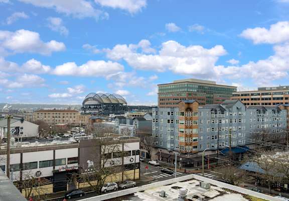 A cityscape with buildings and a clear sky.