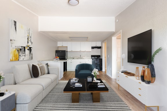 a furnished living room and kitchen area at Mount Dora Apartments