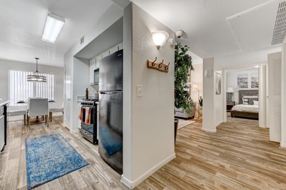 A kitchen with a blue rug on the floor at The Dresden, Las Vegas, NV, 89122