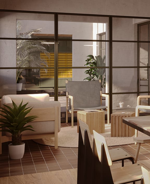 a wooden table in a restaurant with chairs and a plant