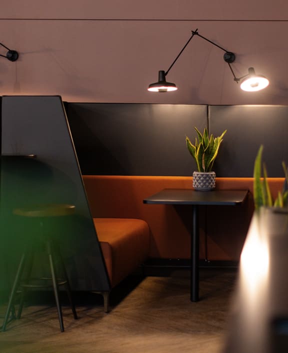 an empty meeting room with chairs and a long table