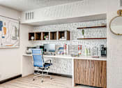 Thumbnail 2 of 28 - A room with a desk and a chair.