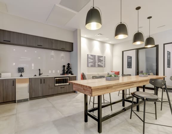 a kitchen and dining area in a 555 waverly unit